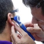 Man receiving a hearing test in Katy