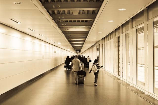 family walking through an airport 