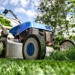 blue and grey lawn mower on a lawn